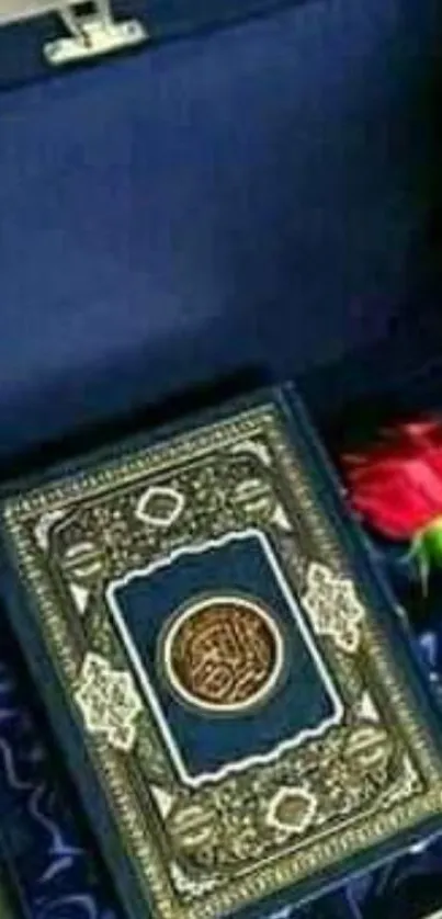 Quran in a blue velvet box with a red rose.