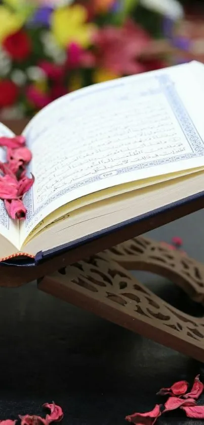 Open Quran on stand with colorful background and petals.