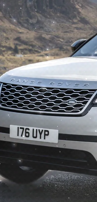 Sleek Range Rover front view on scenic road.