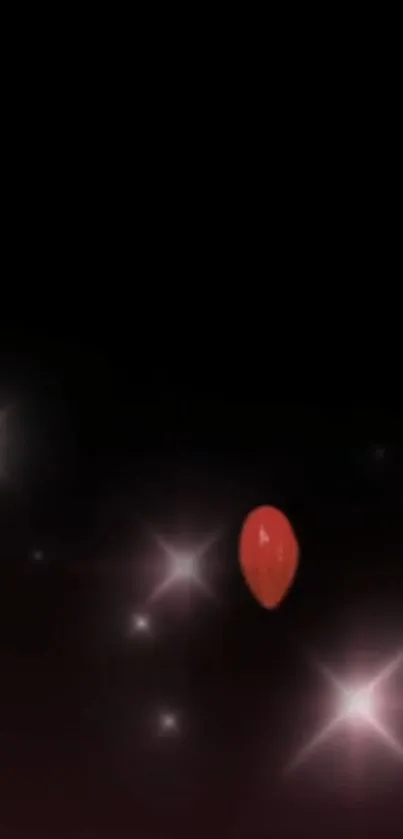 Red balloon with glowing stars on black background.