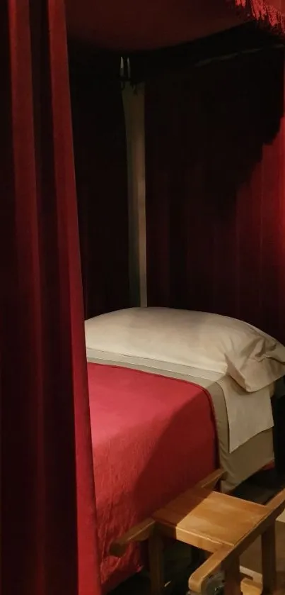 Luxurious red canopy bed with velvet curtains.