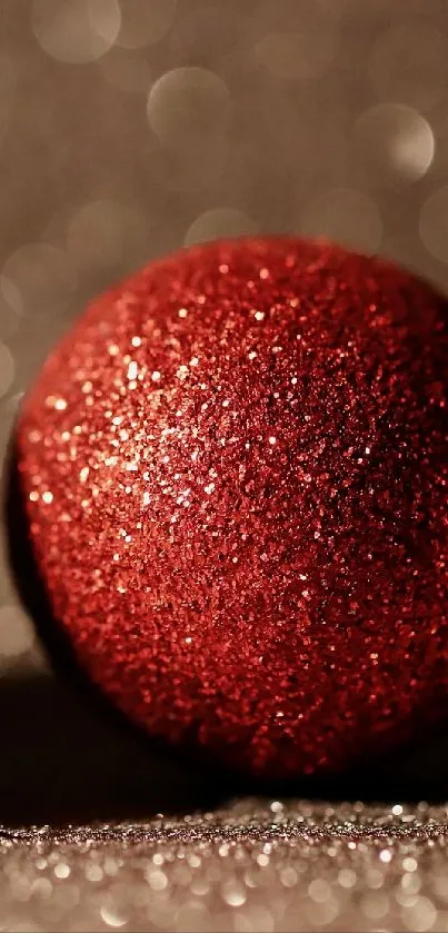 Crimson red Christmas ornaments on a glittering surface.