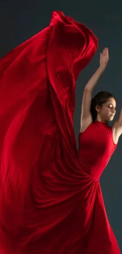 Dancer in a flowing red dress on a dark background.