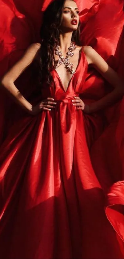 Elegantly dressed figure in flowing red gown on dark background.