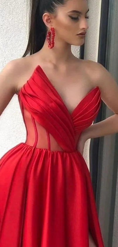 Elegant woman in red dress with stylish design.