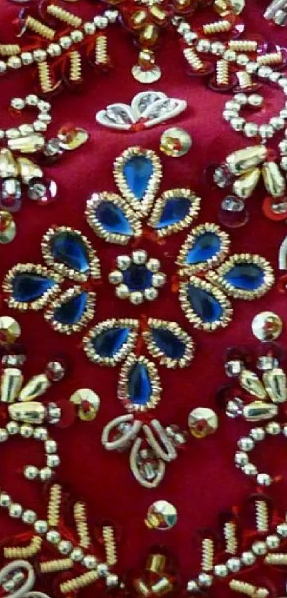 Elegant red wallpaper with blue and gold embroidered pattern.