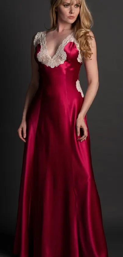 Model in a stunning red gown posing against a dark background.