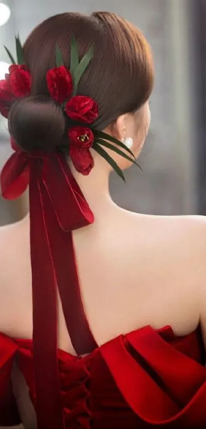 Rear view of elegant hair bun with red flowers and ribbon.