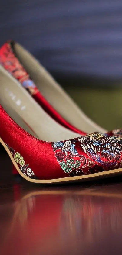 Red floral high-heeled shoe with elegant pattern.