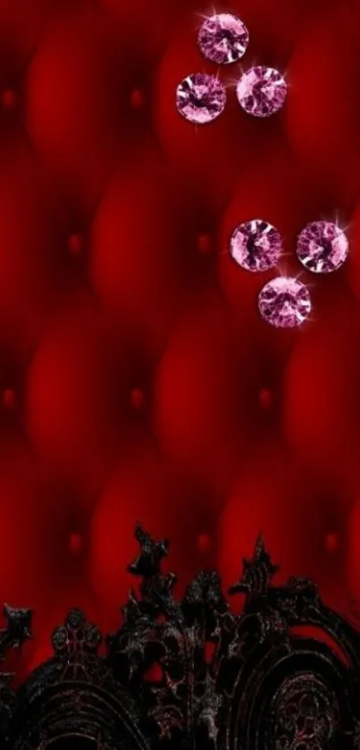 Red wallpaper with pink diamonds and black swirls.