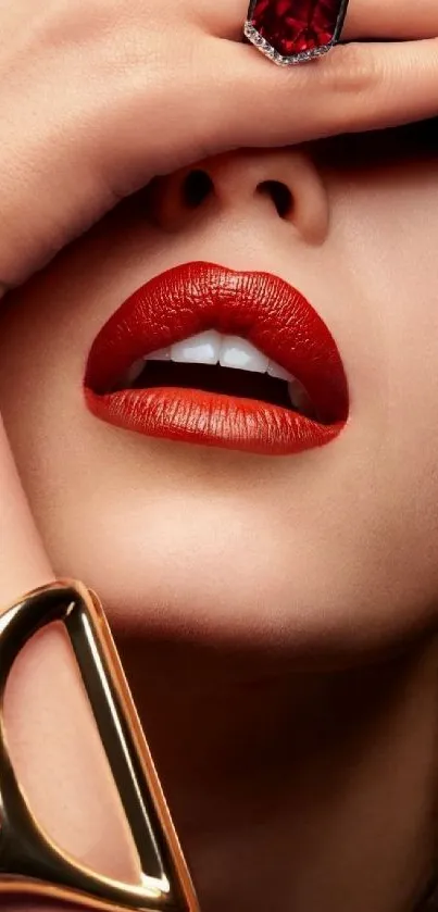 Close-up of red lips with gold and ruby jewelry.