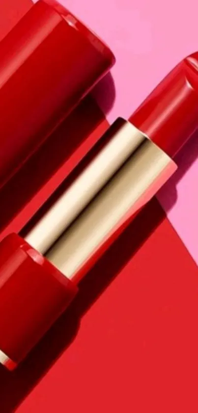 Sleek red lipstick on vibrant pink backdrop.