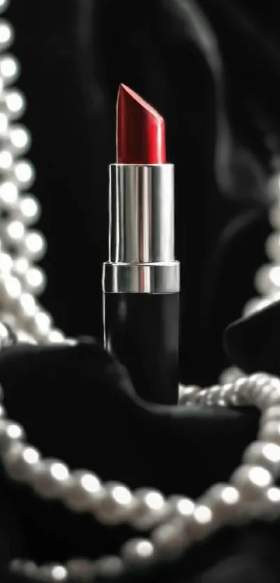 Red lipstick with black velvet and pearls wallpaper.