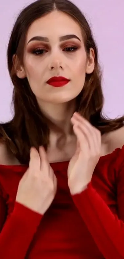 Woman in an elegant red outfit with stylish makeup.