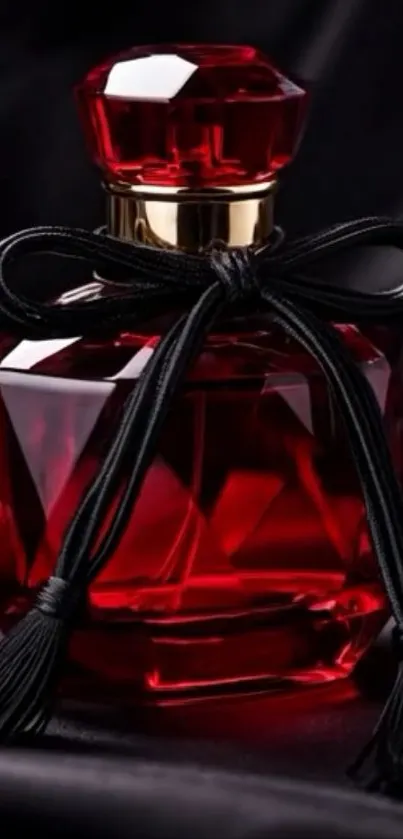 Elegant red perfume bottle with black ribbon.