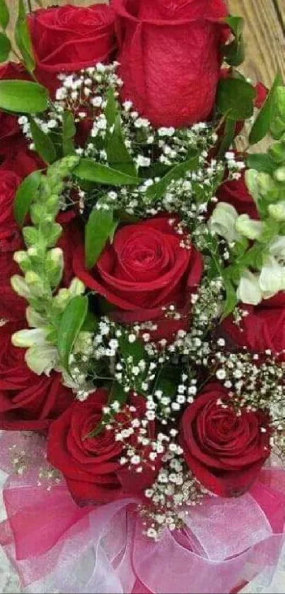 Mobile wallpaper of an elegant red rose bouquet with greenery.