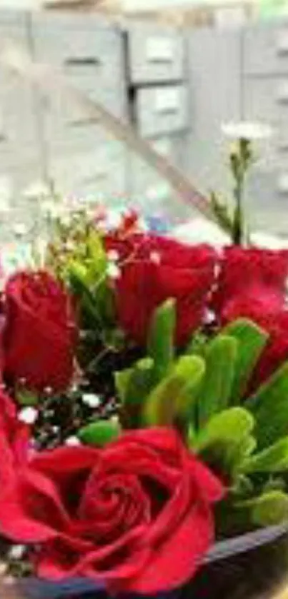 A bouquet of vibrant red roses in an office setting, perfect for a phone wallpaper.