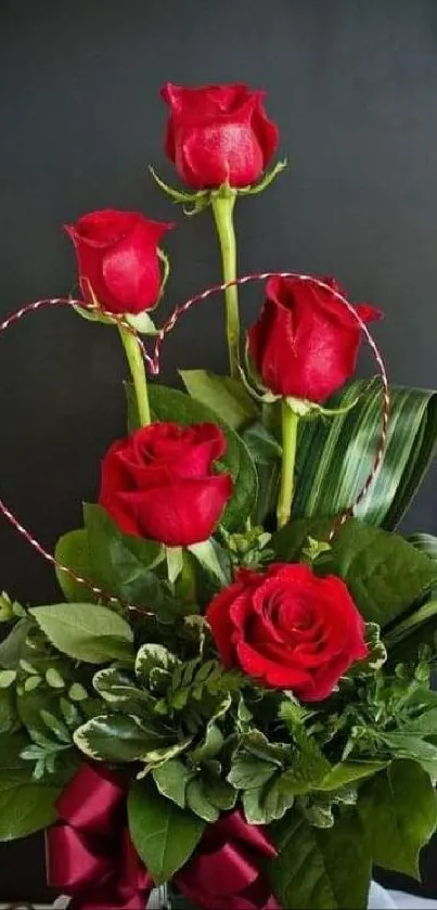 Vibrant red roses with green leaves in a romantic bouquet.