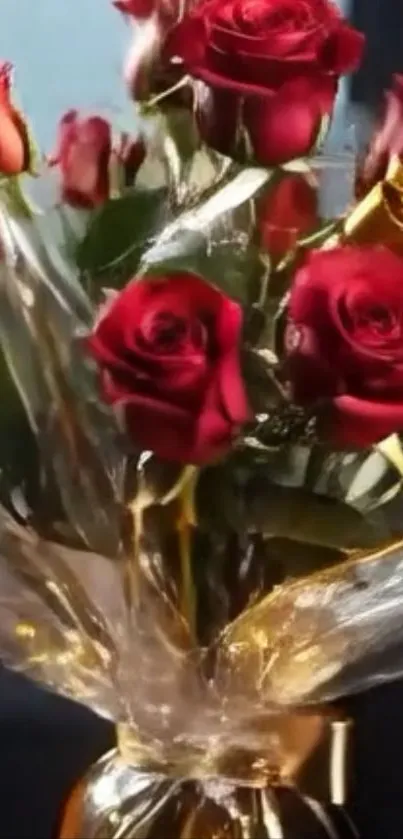 Elegant bouquet of red roses wrapped in golden foil.