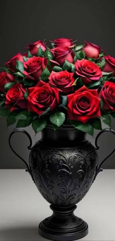 Elegant black vase with red roses bouquet on a muted background.