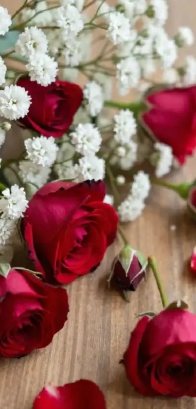 Red roses and white flowers on wood