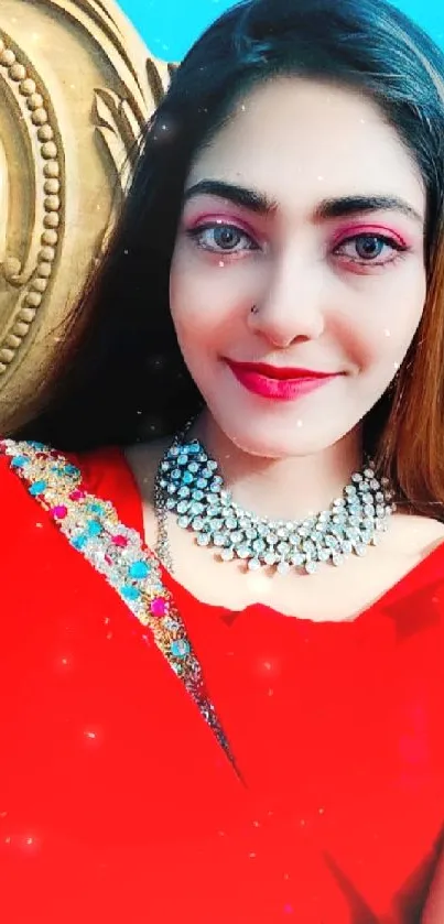 Woman in red saree with silver jewelry smiling.