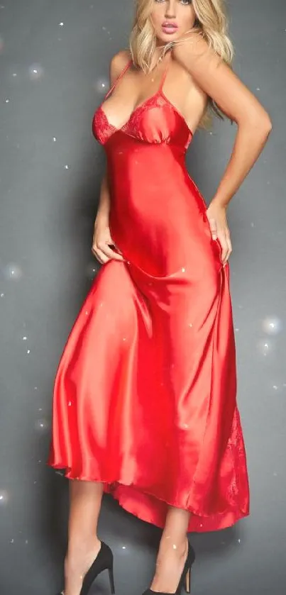 Model in elegant red silk dress poses stylishly on mobile wallpaper.