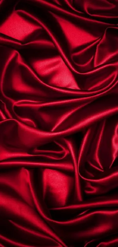 Luxurious red silk fabric folds as mobile wallpaper.