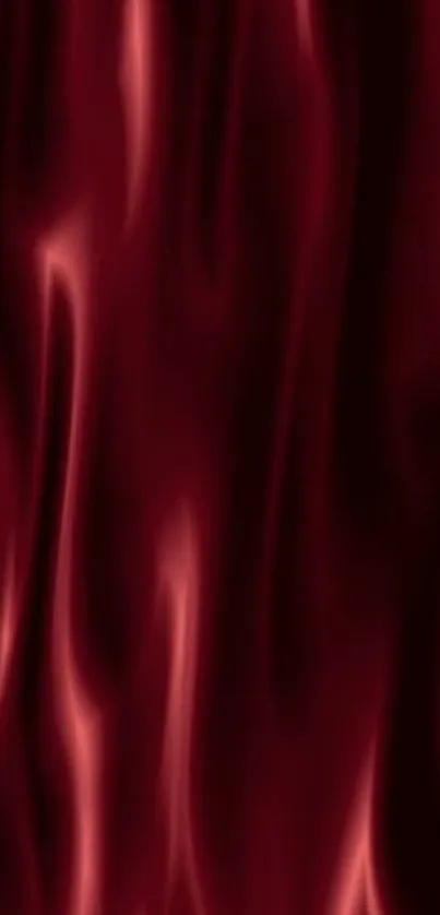 Luxurious and smooth red silk fabric texture on mobile wallpaper.