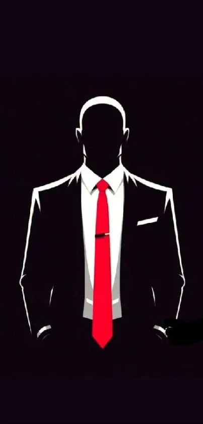 Silhouette in a black suit with a red tie against a dark background.