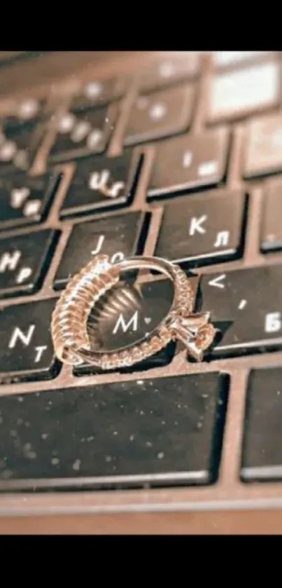 A dazzling ring lies on a black keyboard.