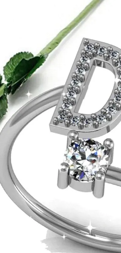 Sparkling ring with letter 'D' and red rose on white background.
