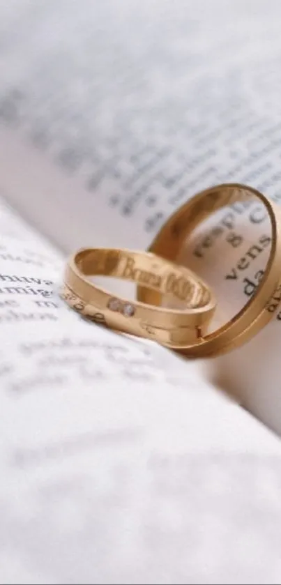 Gold rings on an open book page.