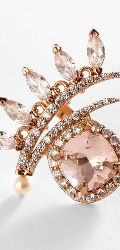 Rose gold brooch with diamonds on a white background.