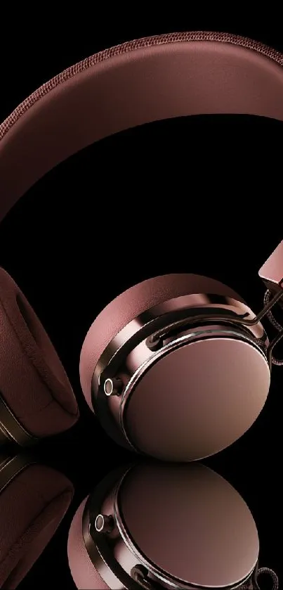 Rose gold headphones against a sleek black background.