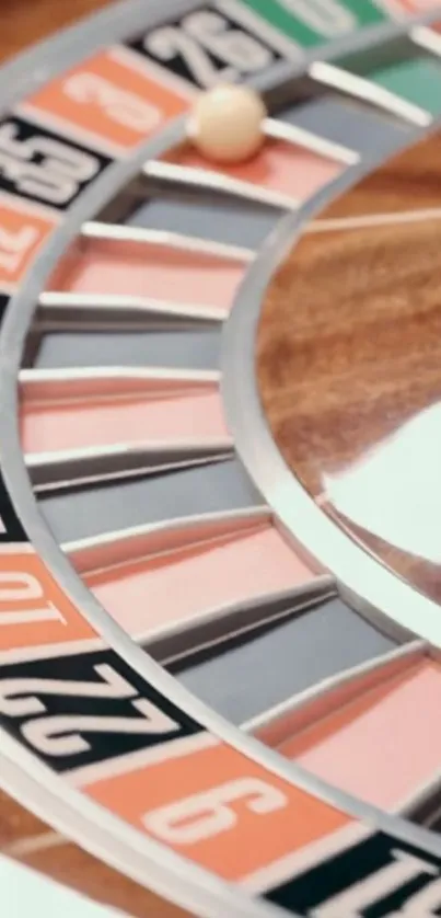 Close-up shot of a roulette wheel with a ball resting on the numbers.