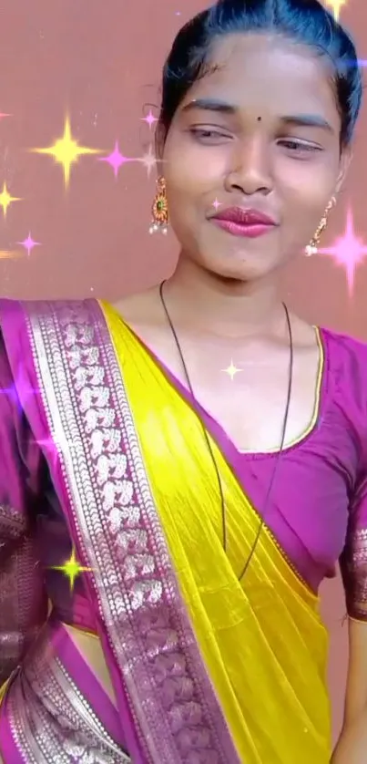 Woman in purple and yellow saree with glittering stars.