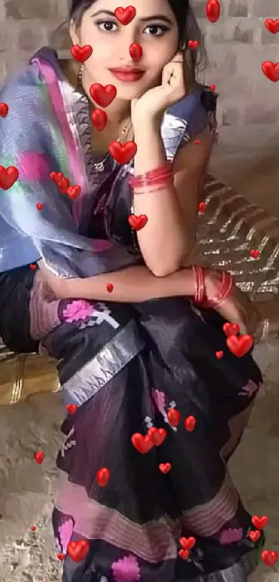 Woman in a saree with heart designs.