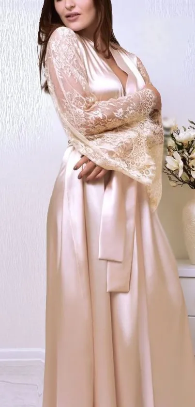 Elegant satin and lace gown with floral accents in a soft cream color.