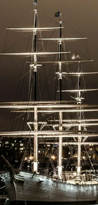 Elegant ship illuminated in night harbor