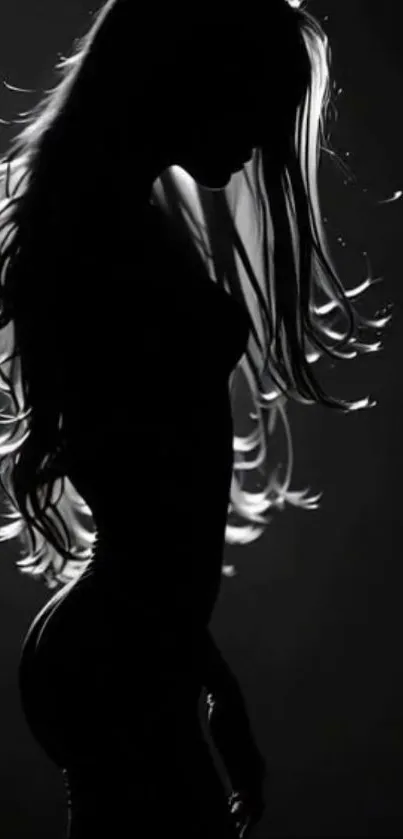 Black and white silhouette with flowing hair.