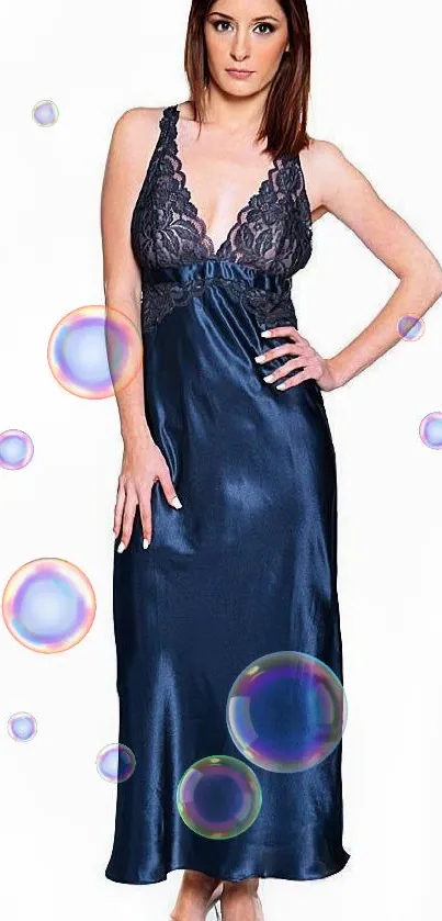 Model in luxurious navy silk evening gown with lace details.