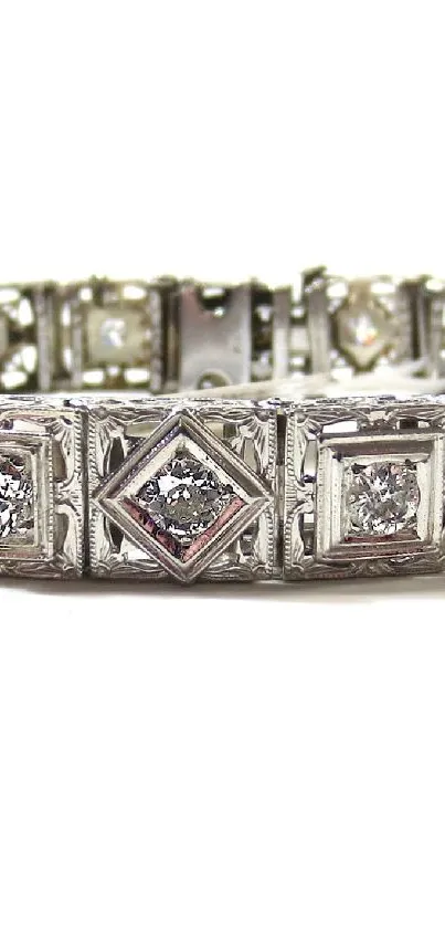 Elegant silver bracelet with intricate design and gemstones.