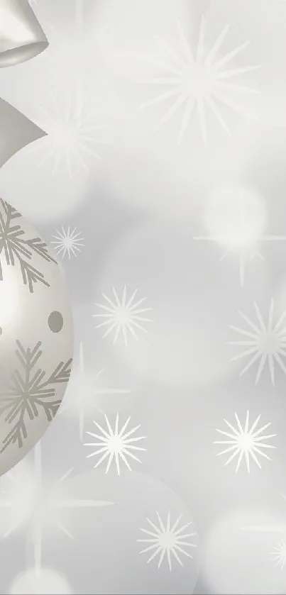 Silver Christmas ornament with bokeh background.
