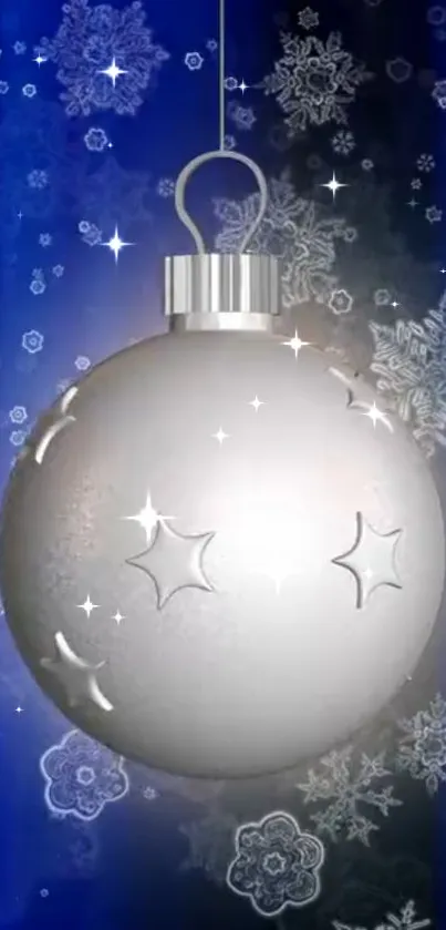 Silver ornament with snowflakes on a blue background wallpaper.