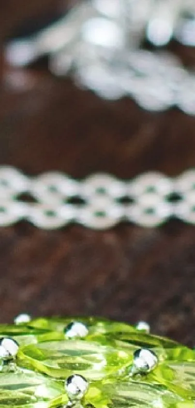 Elegant silver necklace on dark wood surface.