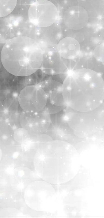 Stylish silver bokeh lights on mobile wallpaper.