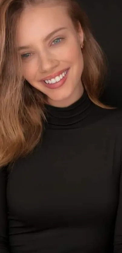 Woman with soft smile and brown hair in elegant portrait on black background.