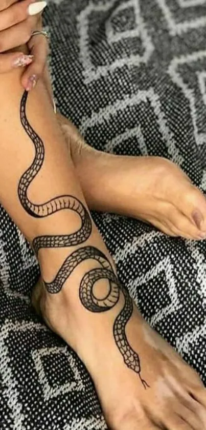 Snake tattoo on foot with geometric background.