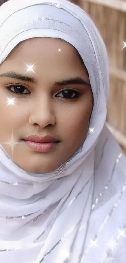 Portrait of a woman in a sparkling white hijab with a serene expression.